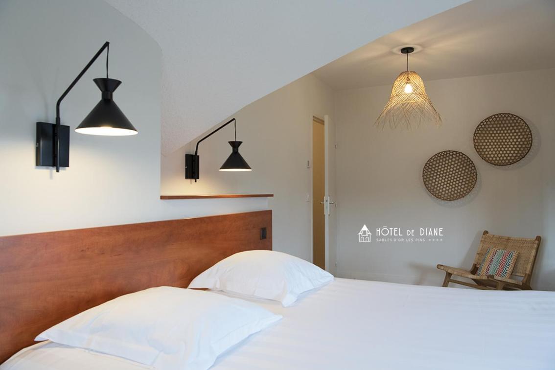 Un ou plusieurs lits dans un hébergement de l'établissement Hotel De Diane