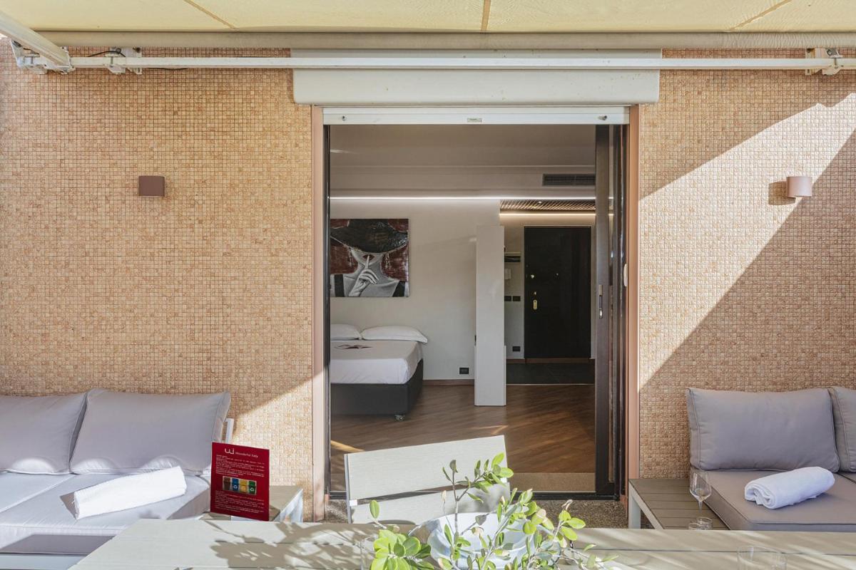 Beachfront Studio with Terrace by Wonderful Italy - Housity