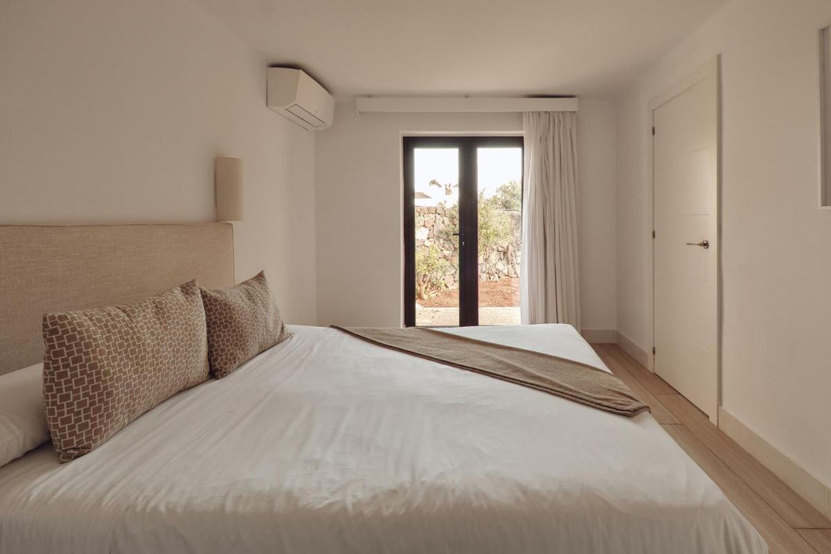 Cama o camas de una habitación en Villas Alondra