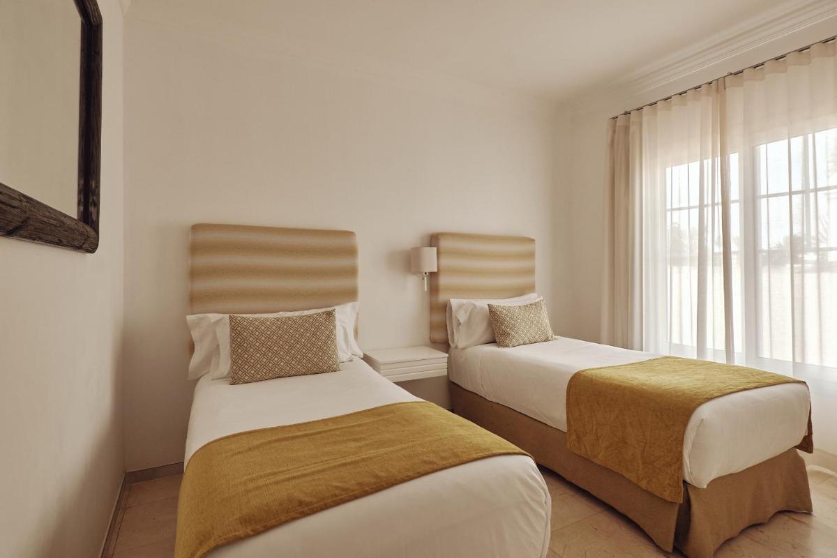 Cama o camas de una habitación en Villas Alondra