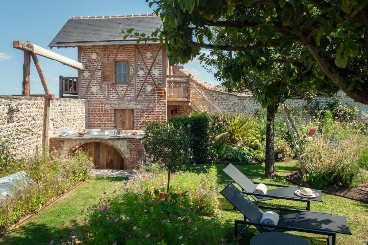 Jardin de l'établissement La Ferme Saint Simeon Hotel & Spa - Relais & Chateaux