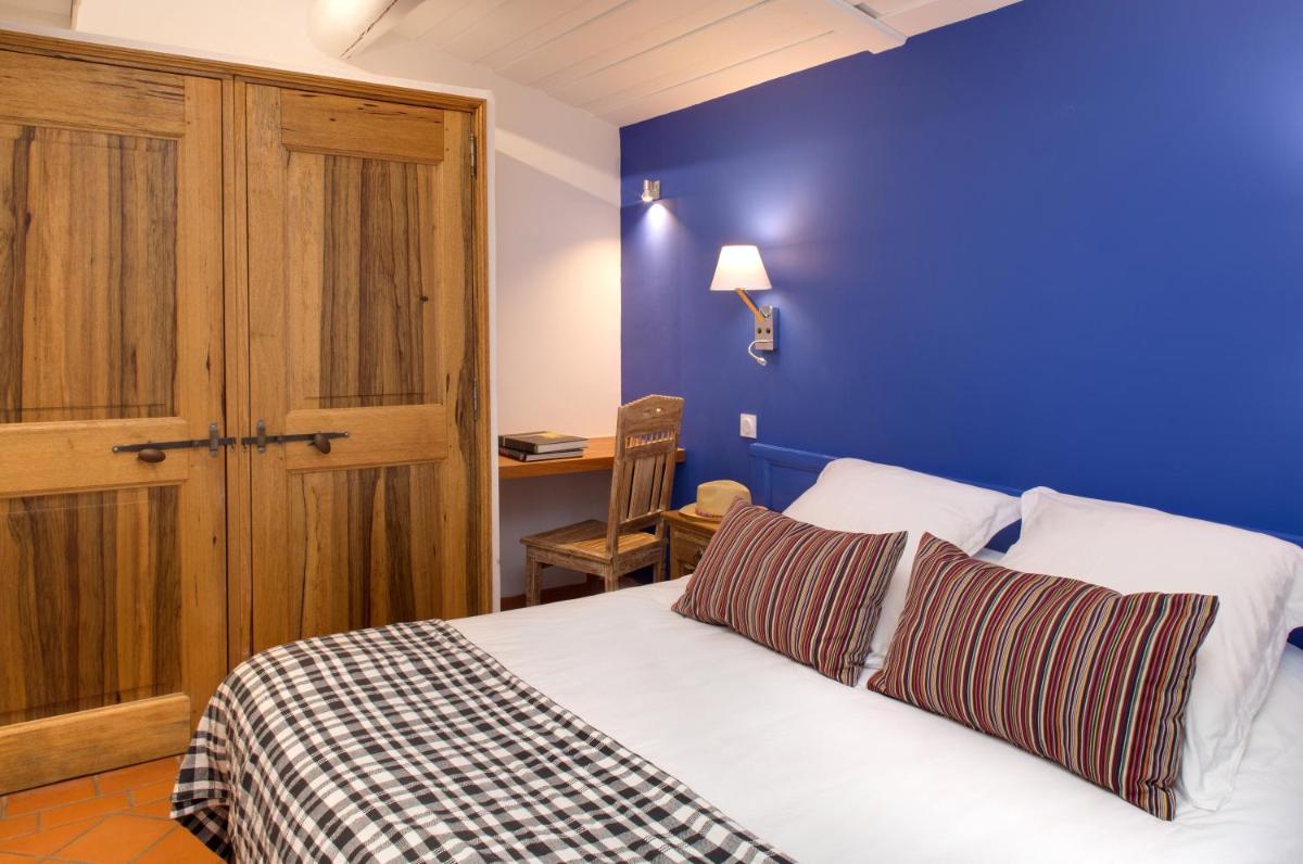 Un ou plusieurs lits dans un hébergement de l'établissement Oustau Camarguen Hôtel & Spa