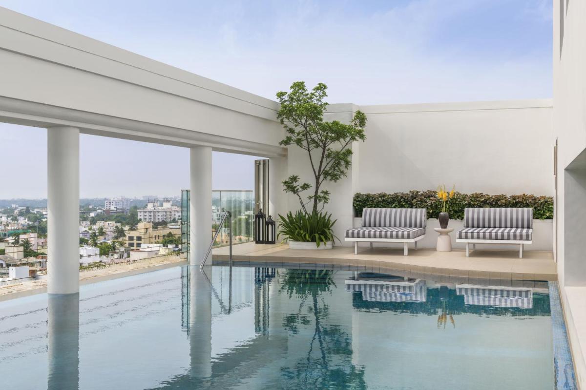 a swimming pool in a house with a view at The Raintree, St. Mary’s Road in Chennai