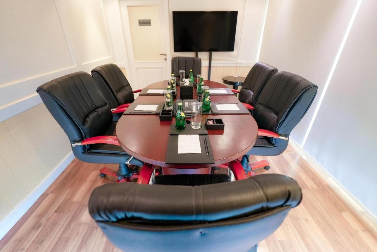 a conference room with a table and chairs at Radisson Blu Kochi in Cochin