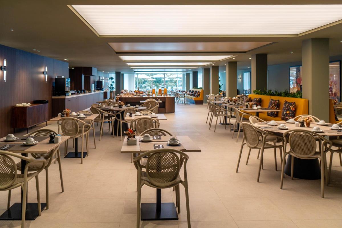 Um restaurante ou outro lugar para comer em The Lince Braga