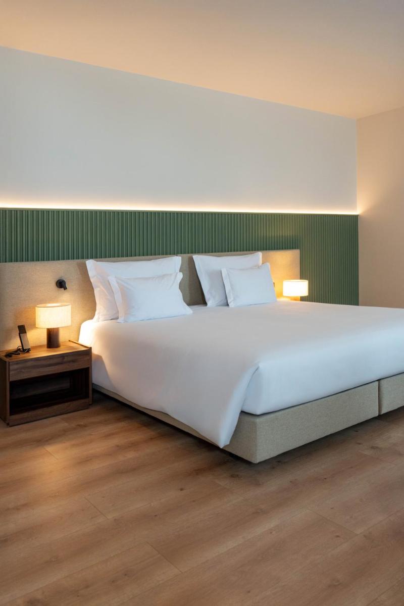 Uma cama ou camas num quarto em The Lince Braga