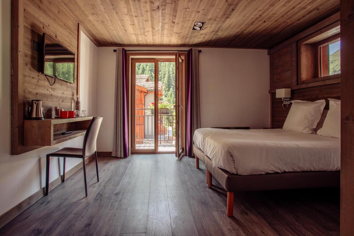 Un ou plusieurs lits dans un hébergement de l'établissement Victoria Lodge, Friendly Hotel