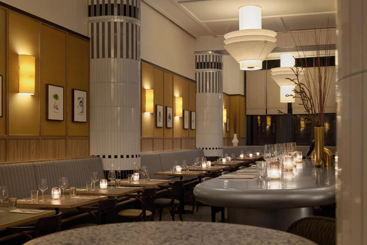 Ein Restaurant oder anderes Speiselokal in der Unterkunft Kimpton Main Frankfurt by IHG