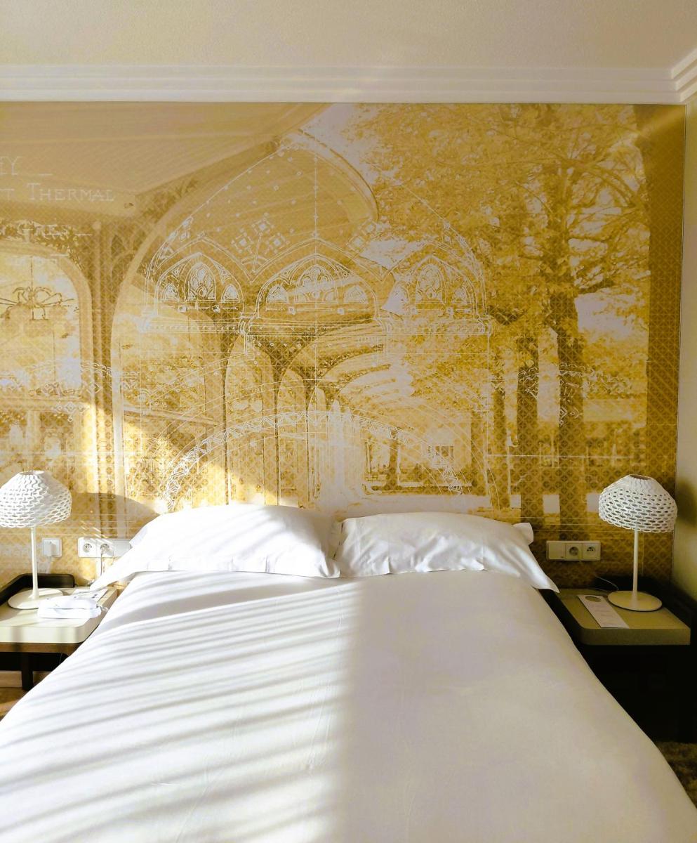 Un ou plusieurs lits dans un hébergement de l'établissement Célestins Spa Thermal & Hôtel by Vy Resort