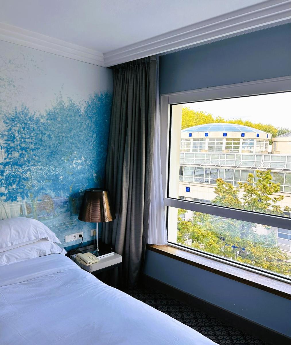 Un ou plusieurs lits dans un hébergement de l'établissement Célestins Spa Thermal & Hôtel by Vy Resort