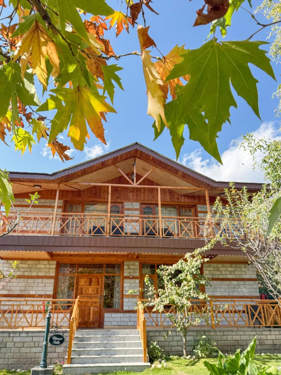 a log house with stairs in front of it at Storii By ITC Hotels Urvashis Retreat, Manali in Manāli
