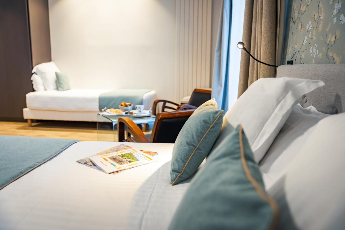 Un ou plusieurs lits dans un hébergement de l'établissement Grand Hôtel du Luxembourg & Spa