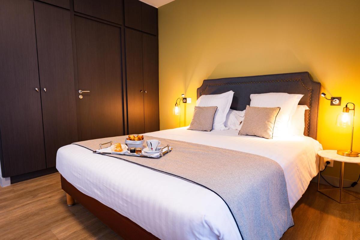 Un ou plusieurs lits dans un hébergement de l'établissement Grand Hôtel du Luxembourg & Spa