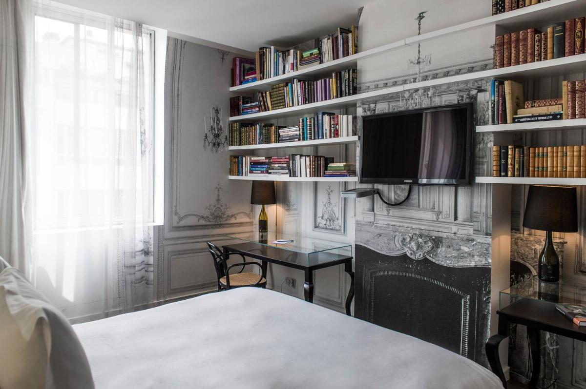 Un ou plusieurs lits dans un hébergement de l'établissement La Maison Champs Elysées