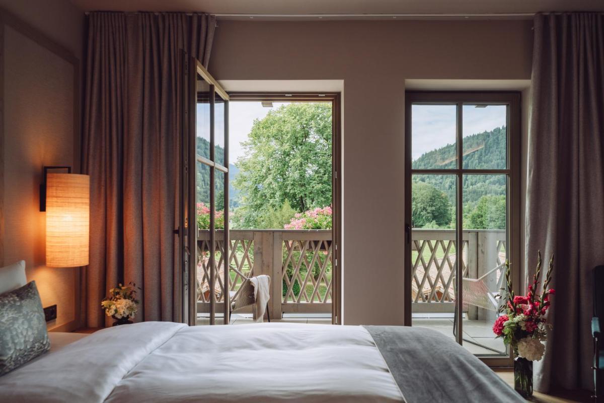 Ein Bett oder Betten in einem Zimmer der Unterkunft Parkhotel Egerner Höfe