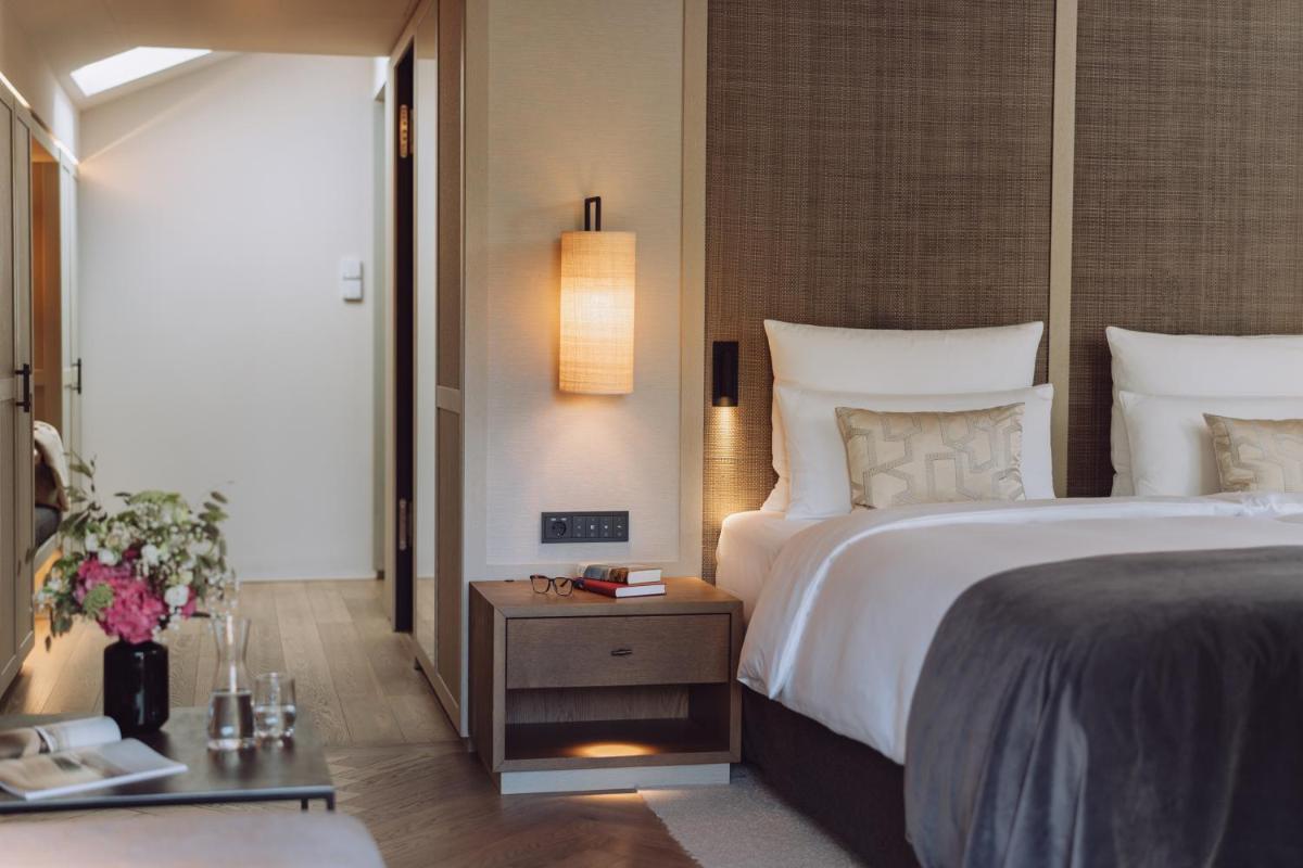 Ein Bett oder Betten in einem Zimmer der Unterkunft Parkhotel Egerner Höfe