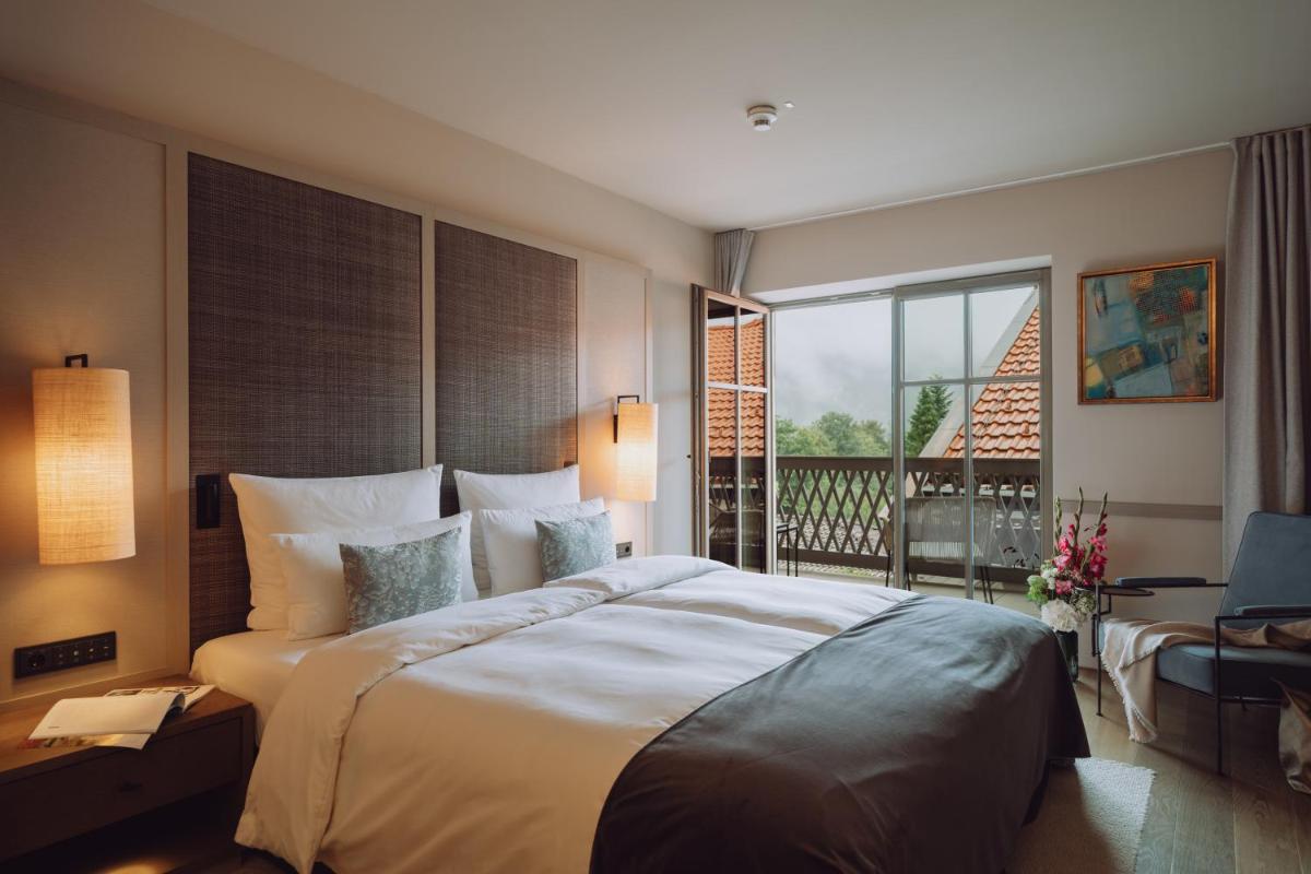 Ein Bett oder Betten in einem Zimmer der Unterkunft Parkhotel Egerner Höfe