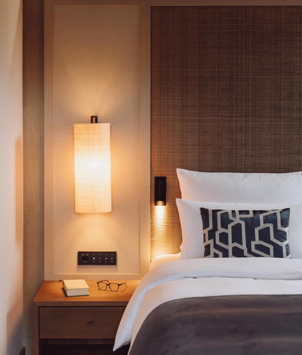 Ein Bett oder Betten in einem Zimmer der Unterkunft Parkhotel Egerner Höfe