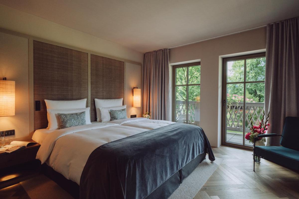 Ein Bett oder Betten in einem Zimmer der Unterkunft Parkhotel Egerner Höfe