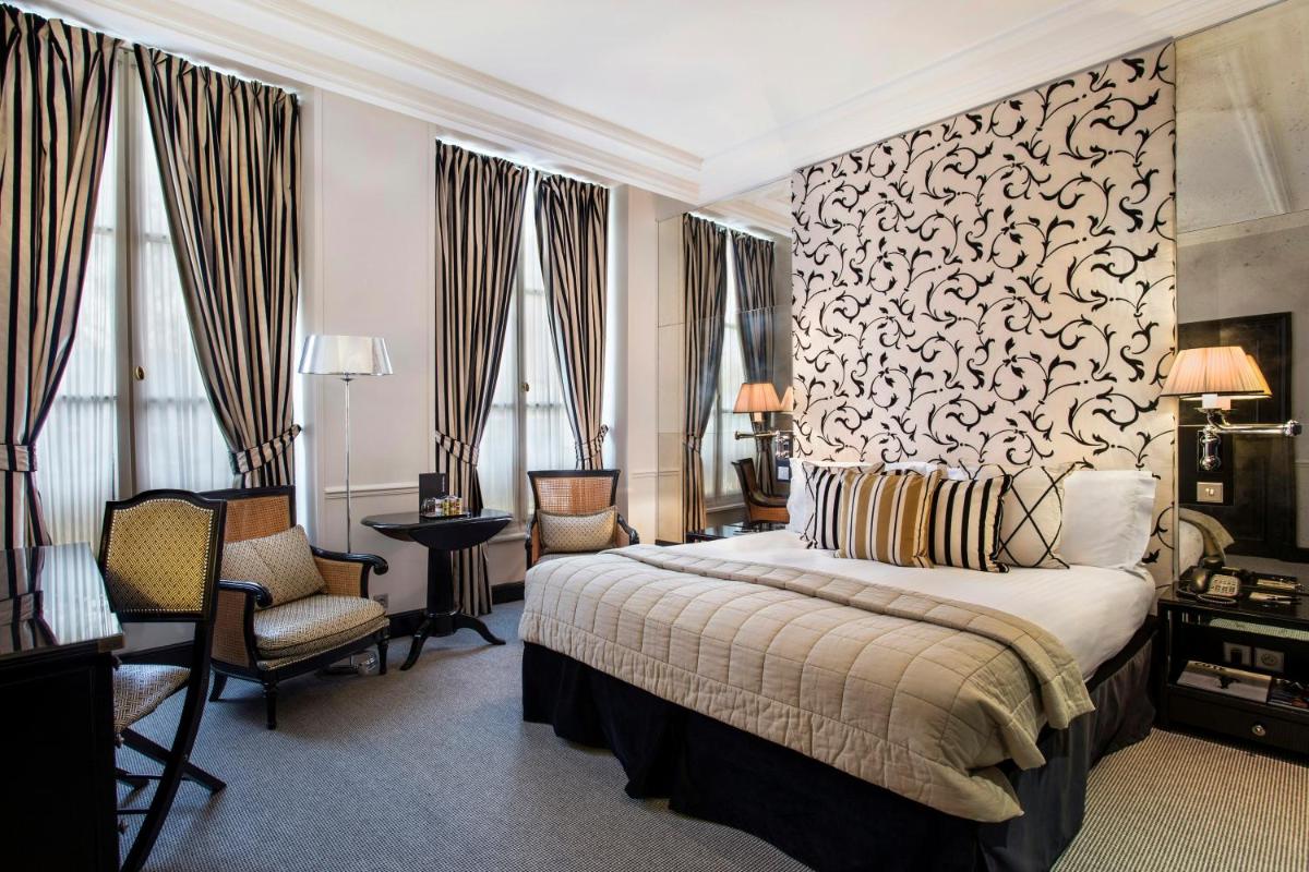 Un ou plusieurs lits dans un hébergement de l'établissement Castille Paris – Starhotels Collezione