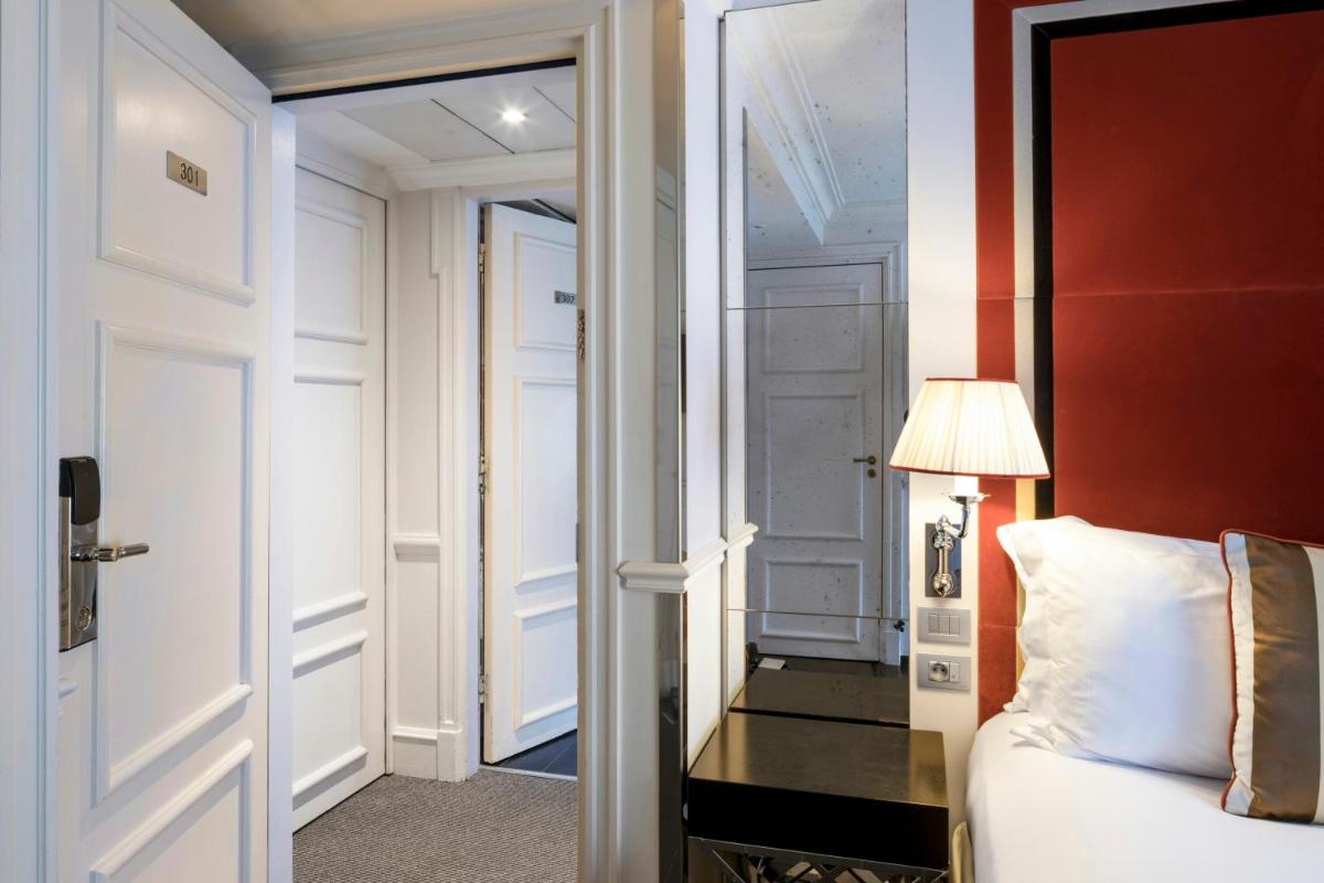Un ou plusieurs lits dans un hébergement de l'établissement Castille Paris – Starhotels Collezione