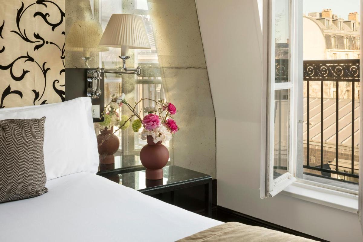 Un ou plusieurs lits dans un hébergement de l'établissement Castille Paris – Starhotels Collezione