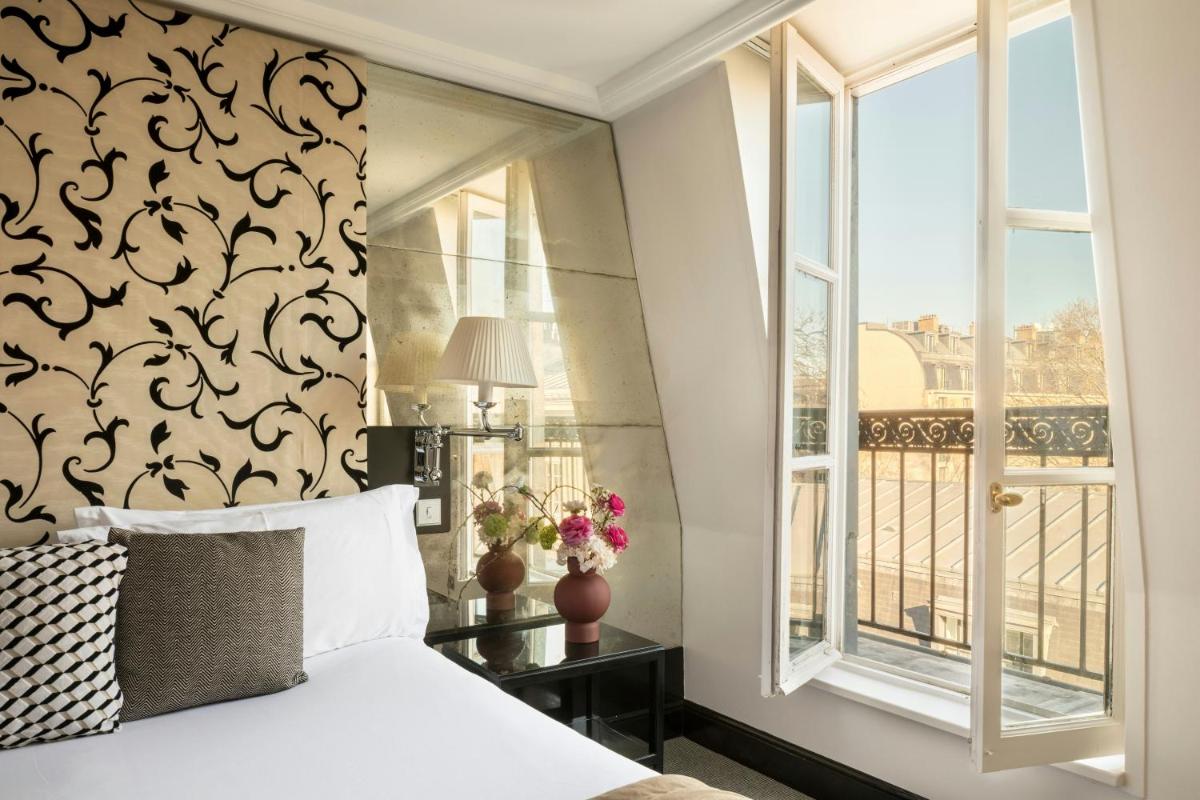 Un ou plusieurs lits dans un hébergement de l'établissement Castille Paris – Starhotels Collezione