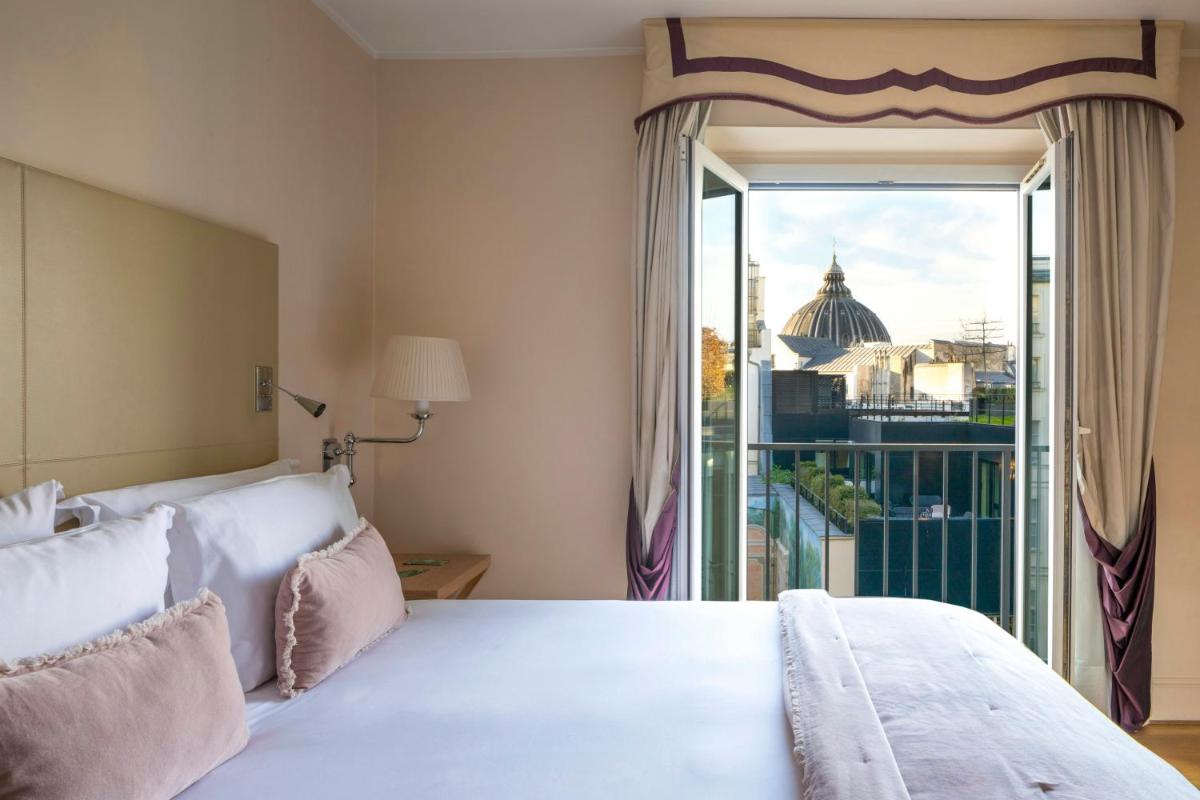 Un ou plusieurs lits dans un hébergement de l'établissement Castille Paris – Starhotels Collezione