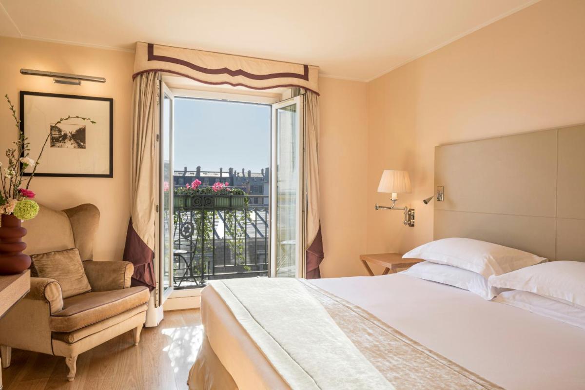 Un ou plusieurs lits dans un hébergement de l'établissement Castille Paris – Starhotels Collezione