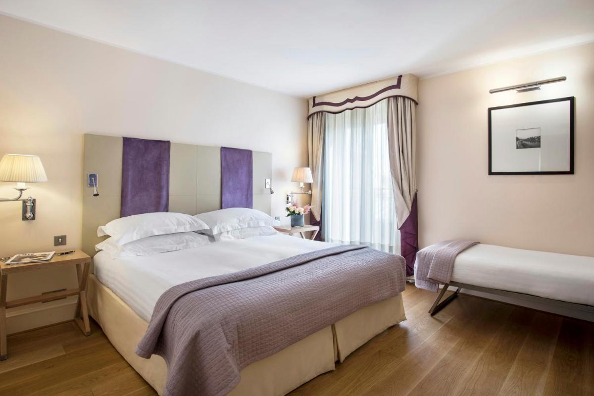 Un ou plusieurs lits dans un hébergement de l'établissement Castille Paris – Starhotels Collezione