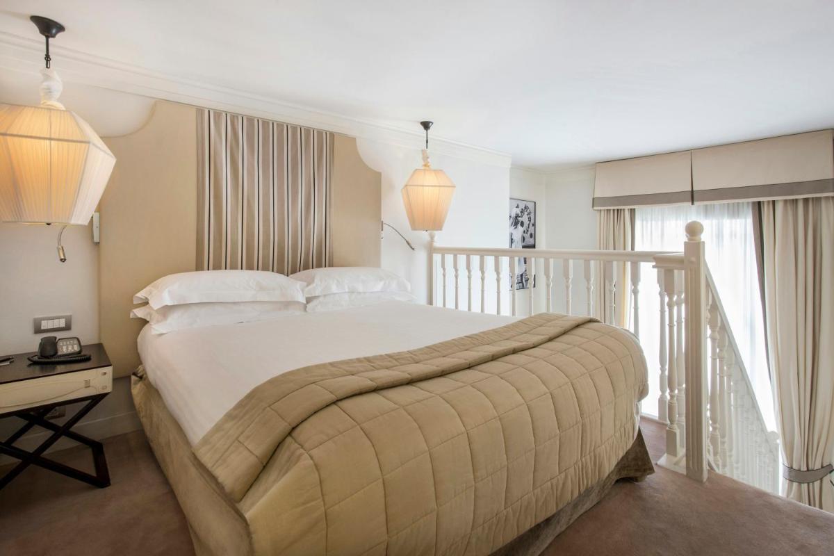 Un ou plusieurs lits dans un hébergement de l'établissement Castille Paris – Starhotels Collezione