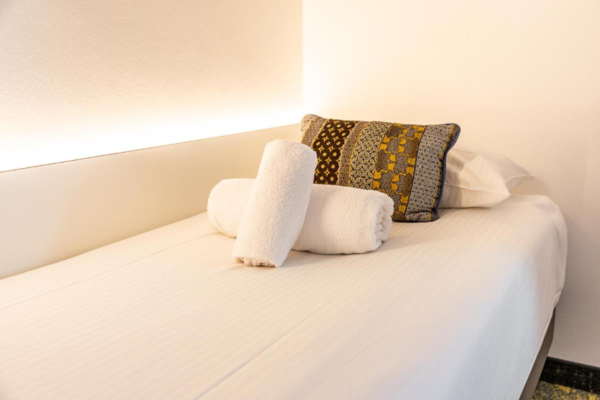 Un ou plusieurs lits dans un hébergement de l'établissement Brit Hotel, Spa & Restaurant - Colmar Est