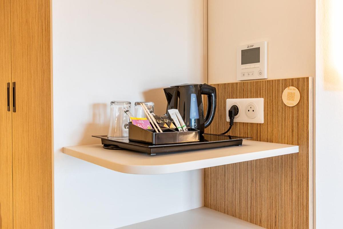 Cuisine ou kitchenette dans l'établissement Brit Hotel, Spa & Restaurant - Colmar Est