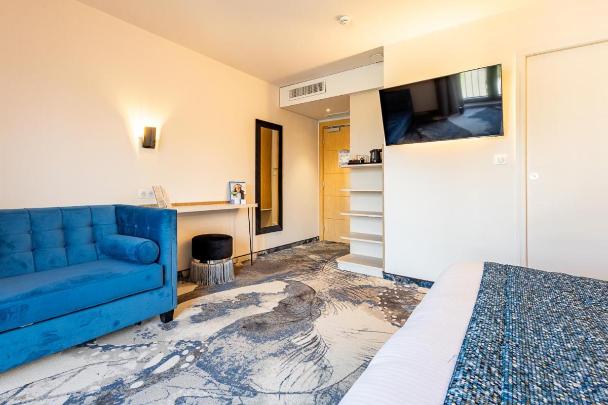 Télévision ou salle de divertissement dans l'établissement Brit Hotel, Spa & Restaurant - Colmar Est