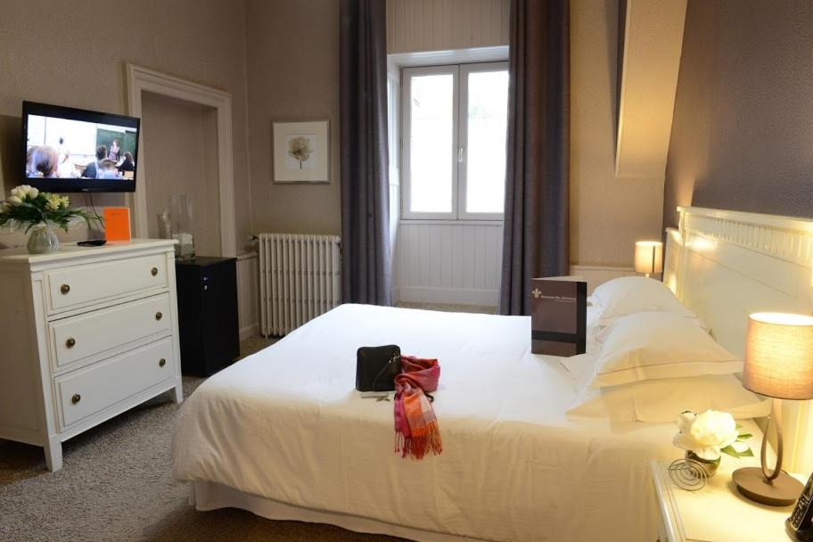 Un ou plusieurs lits dans un hébergement de l'établissement Domaine de Joinville & Spa
