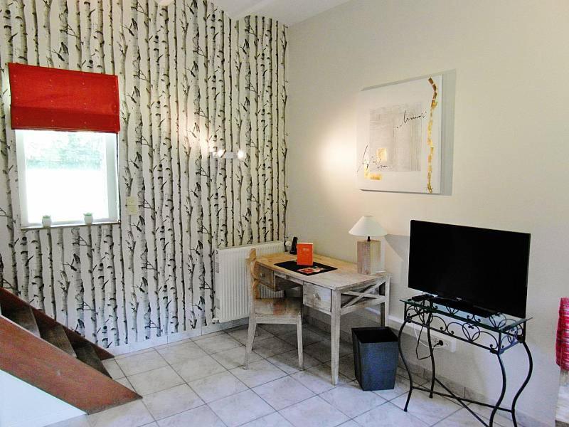 Télévision ou salle de divertissement dans l'établissement Domaine de Joinville & Spa