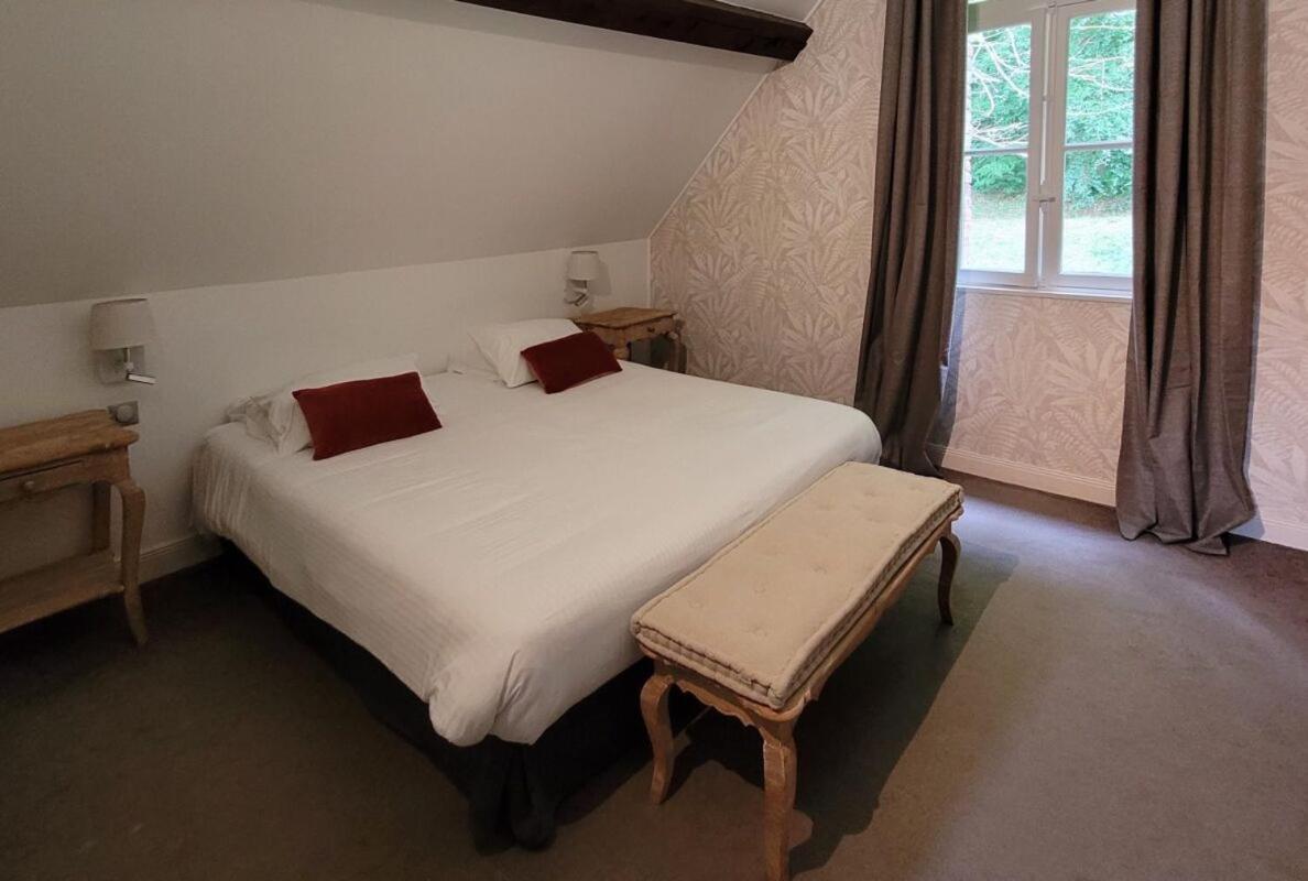 Un ou plusieurs lits dans un hébergement de l'établissement Domaine de Joinville & Spa