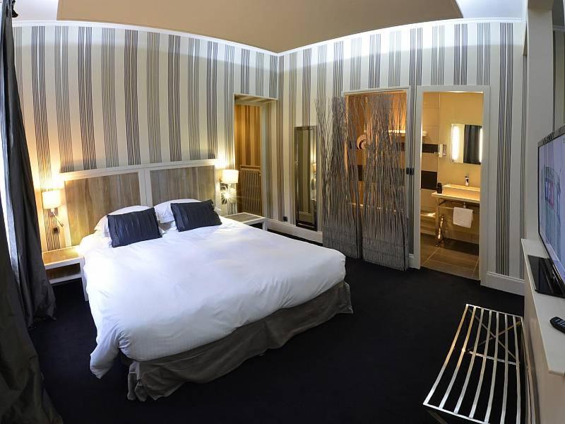 Un ou plusieurs lits dans un hébergement de l'établissement Domaine de Joinville & Spa