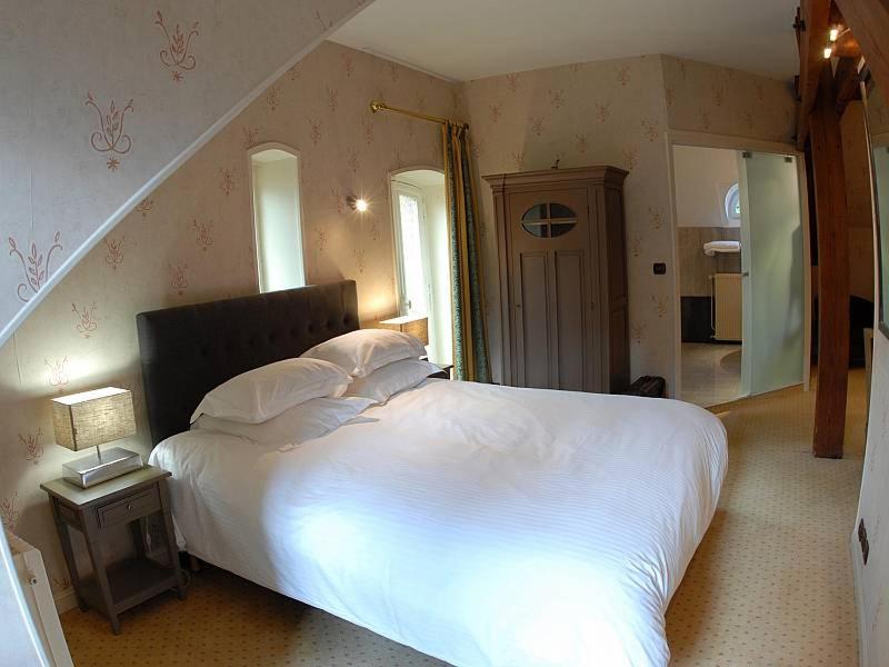 Un ou plusieurs lits dans un hébergement de l'établissement Domaine de Joinville & Spa