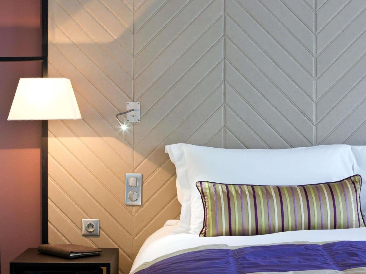 Un ou plusieurs lits dans un hébergement de l'établissement Sofitel Strasbourg Grande Ile