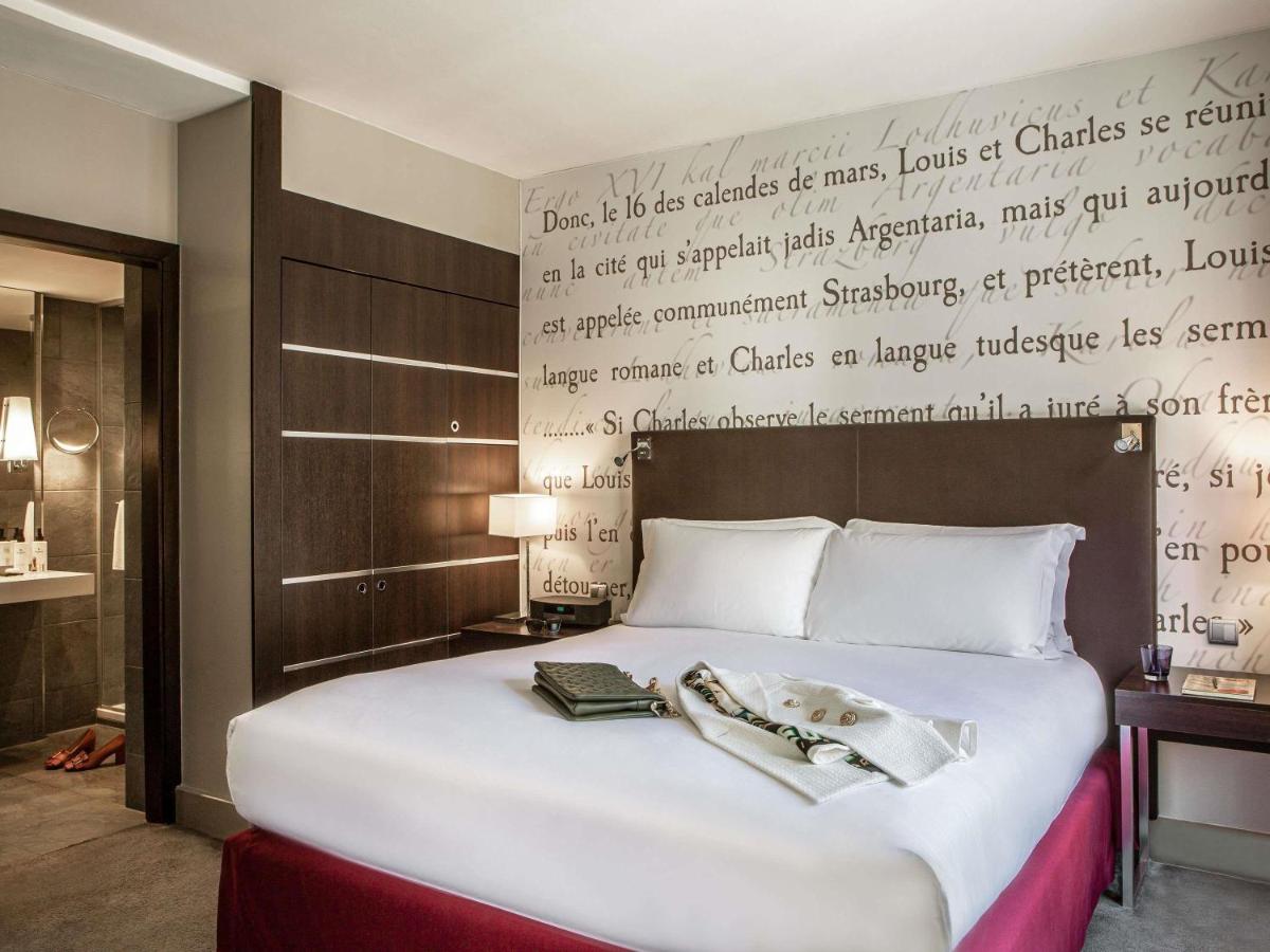 Un ou plusieurs lits dans un hébergement de l'établissement Sofitel Strasbourg Grande Ile