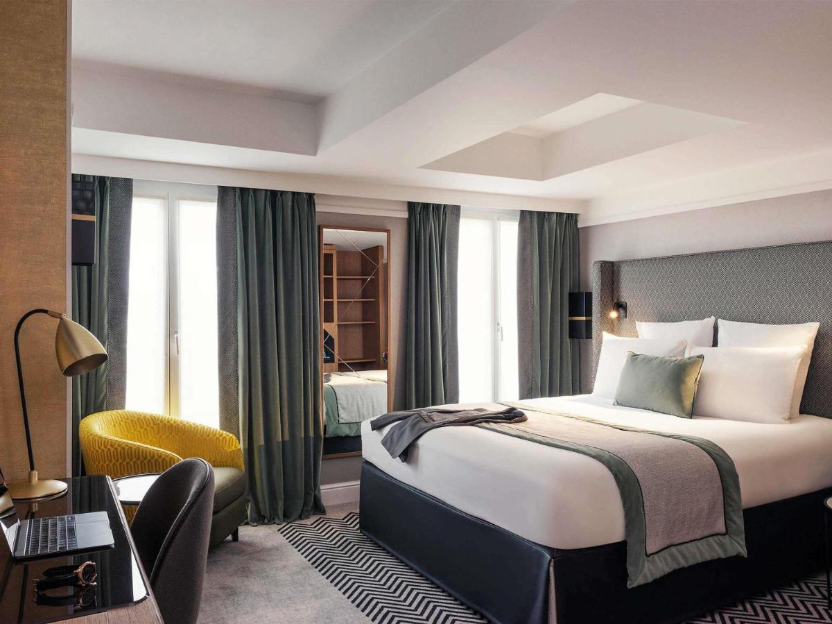 Un ou plusieurs lits dans un hébergement de l'établissement Mercure Paris Opera Garnier Hôtel & Spa