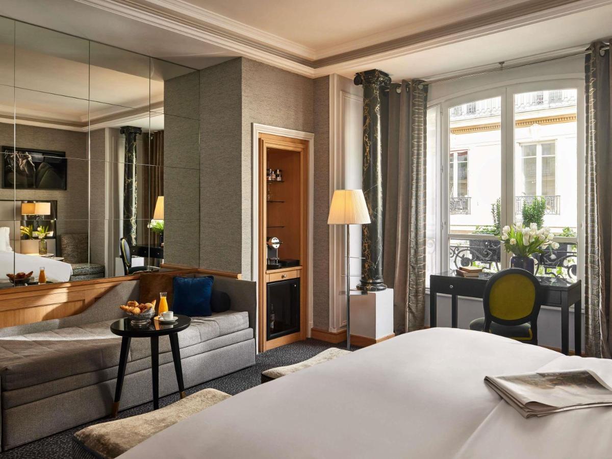 Un ou plusieurs lits dans un hébergement de l'établissement Sofitel Paris Baltimore Tour Eiffel