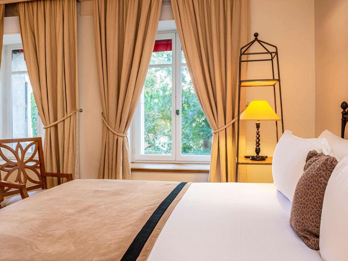 Un ou plusieurs lits dans un hébergement de l'établissement Hotel de la Cité Carcassonne - MGallery Collection