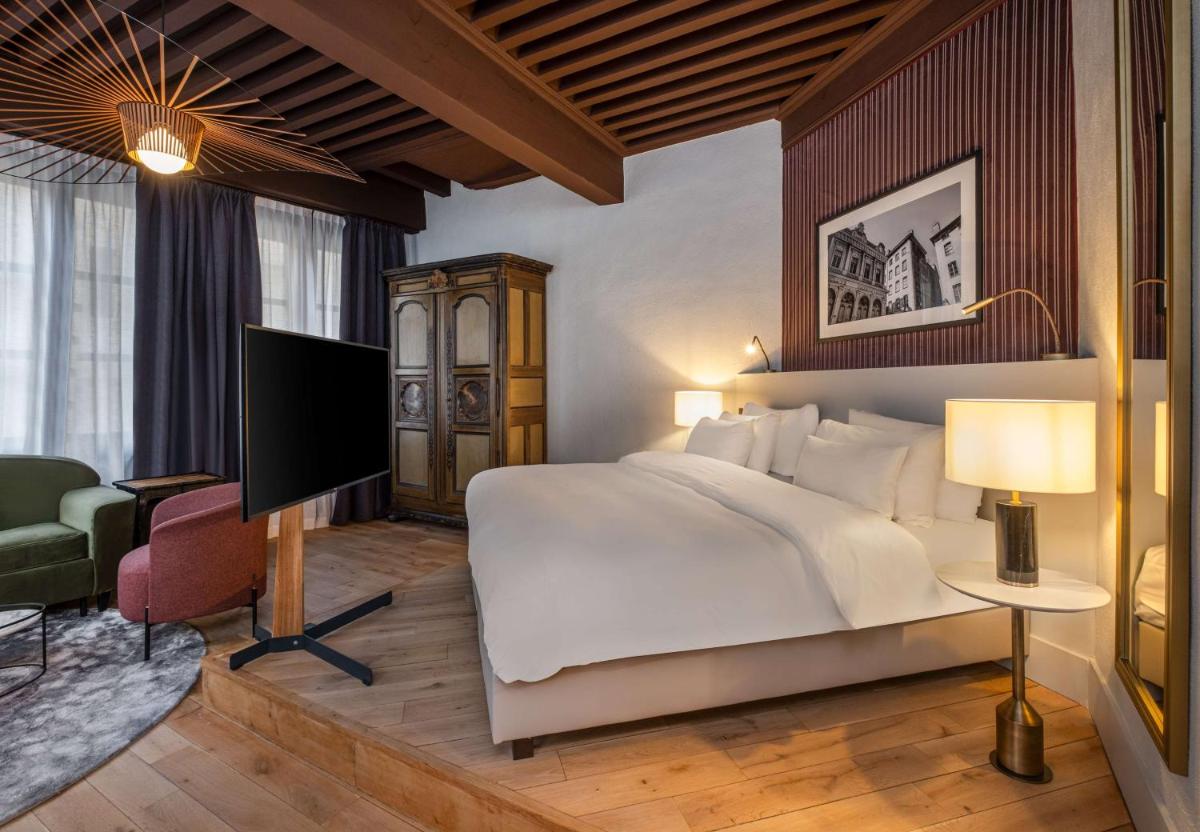 Un ou plusieurs lits dans un hébergement de l'établissement Cour des Loges Lyon, A Radisson Collection Hotel