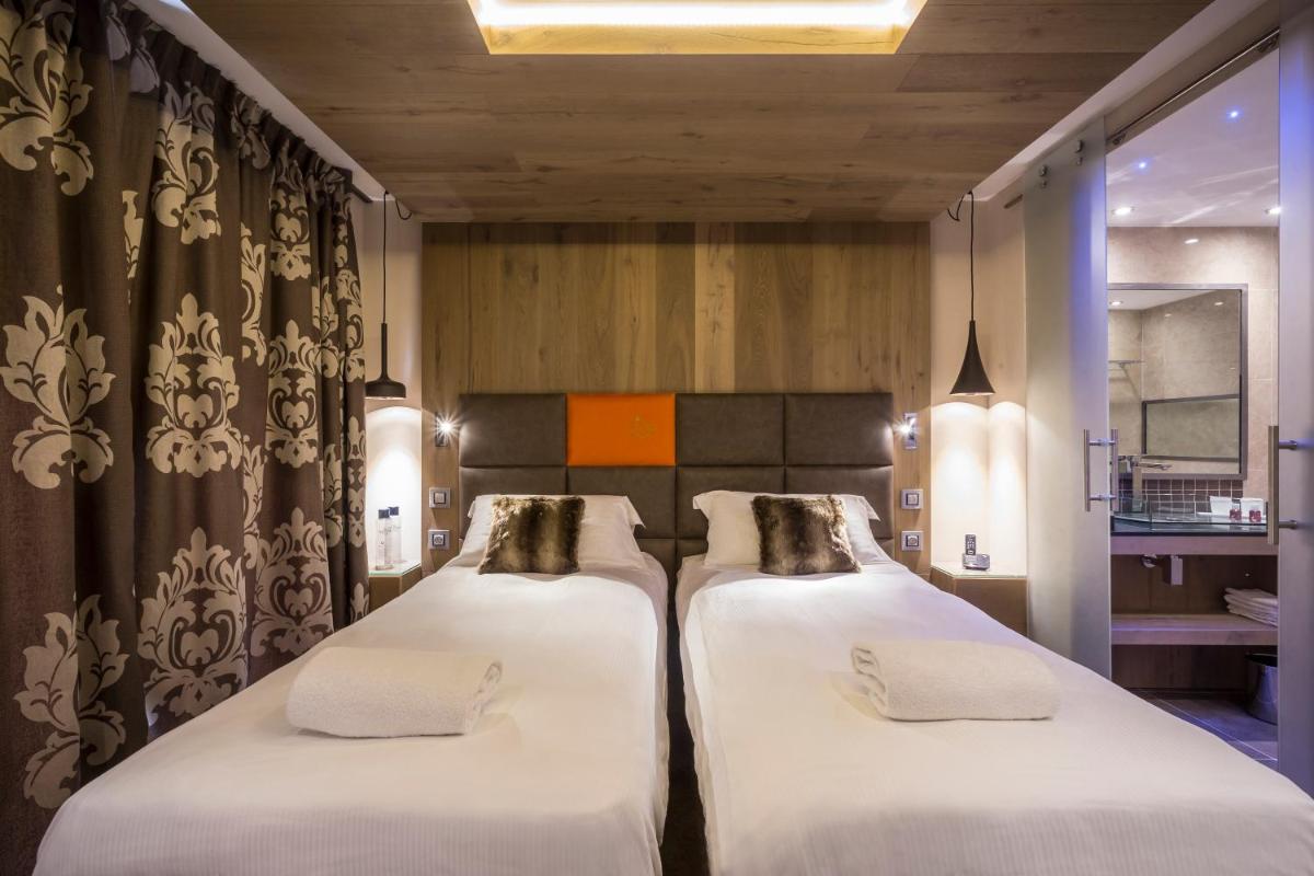 Un ou plusieurs lits dans un hébergement de l'établissement Hôtel Taj-I Mah by Les Etincelles