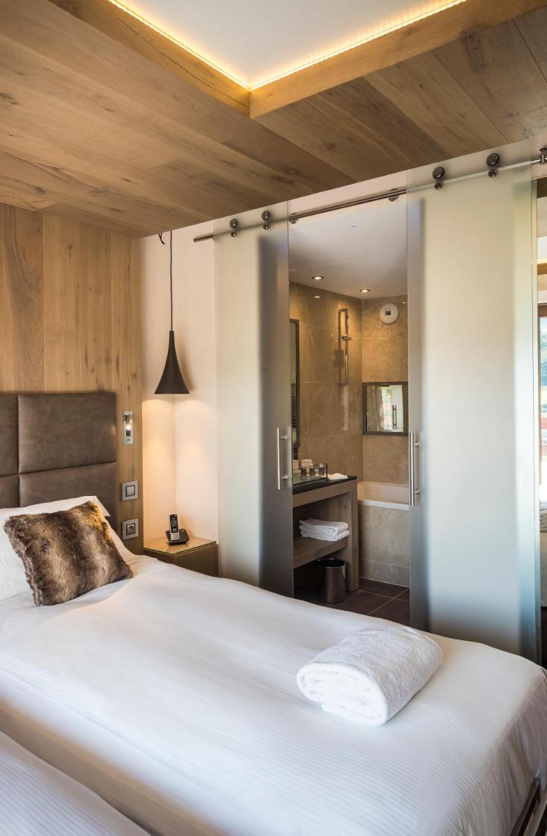 Un ou plusieurs lits dans un hébergement de l'établissement Hôtel Taj-I Mah by Les Etincelles