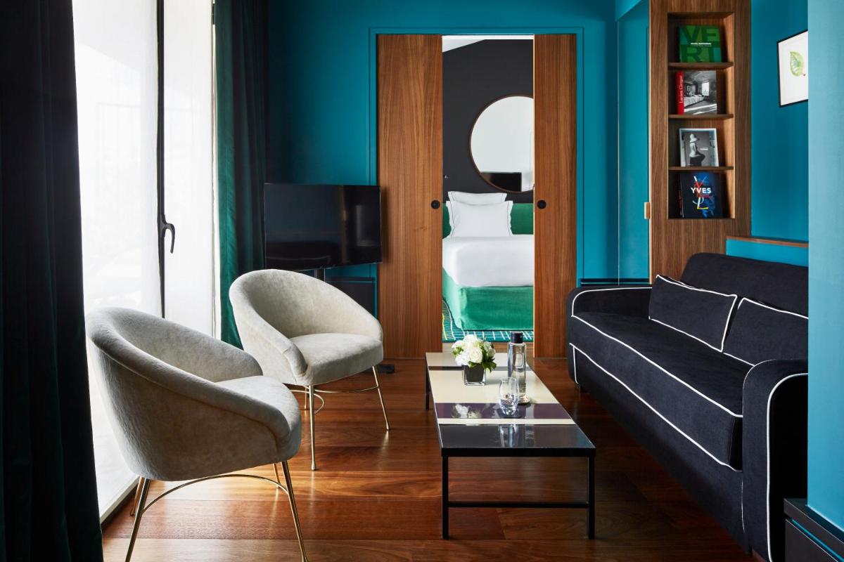 Coin salon dans l'établissement Le Roch Hotel & Spa
