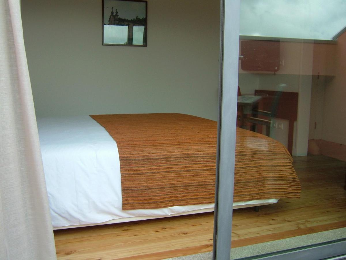 Uma cama ou camas num quarto em Hotel Quinta da Cruz & SPA