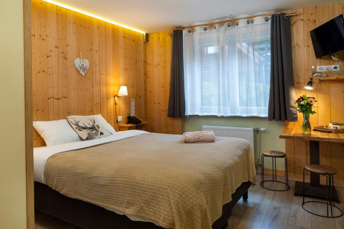 Un ou plusieurs lits dans un hébergement de l'établissement Domaine du Hirtz, Restaurant & Spa